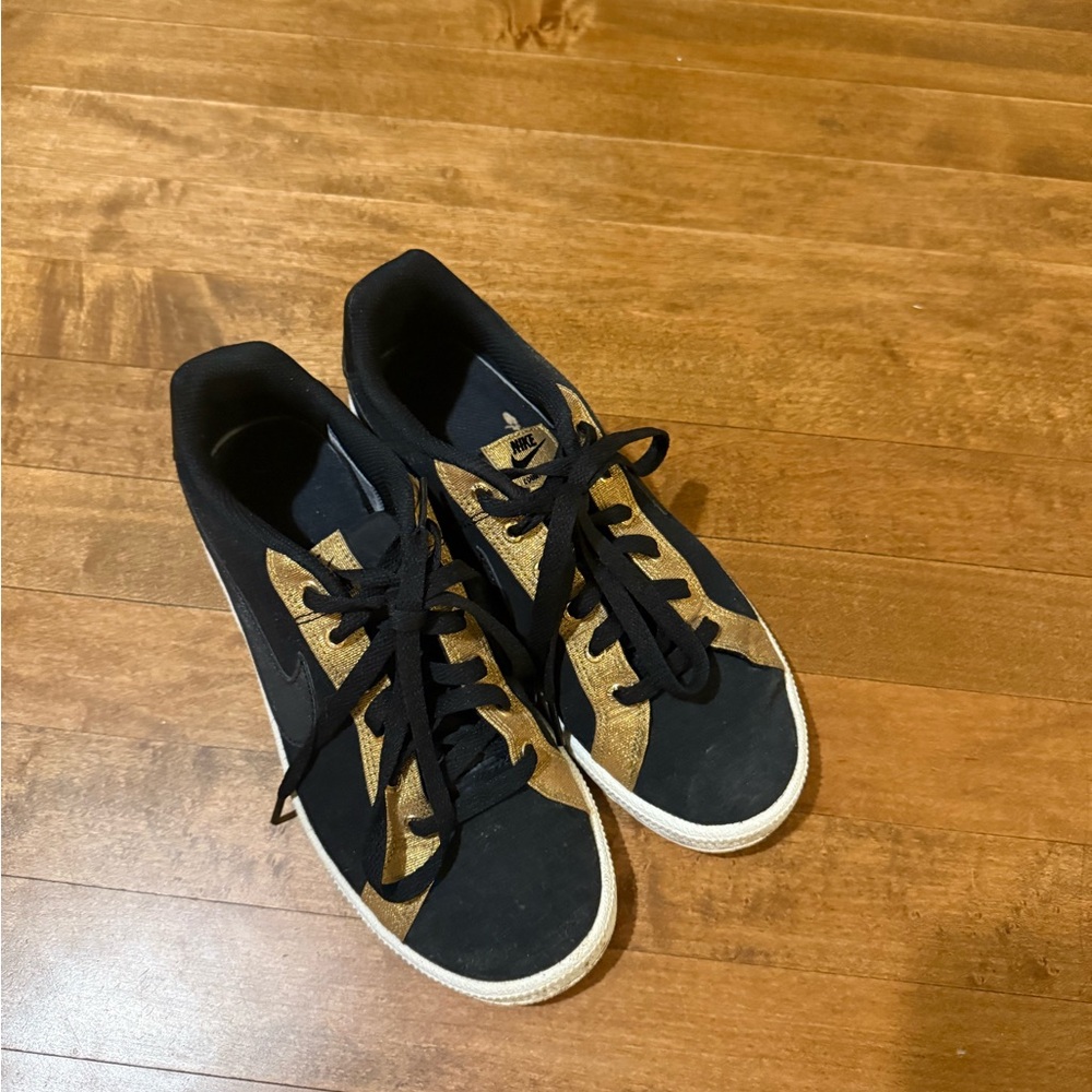 Black and Gold Nike Sneakers